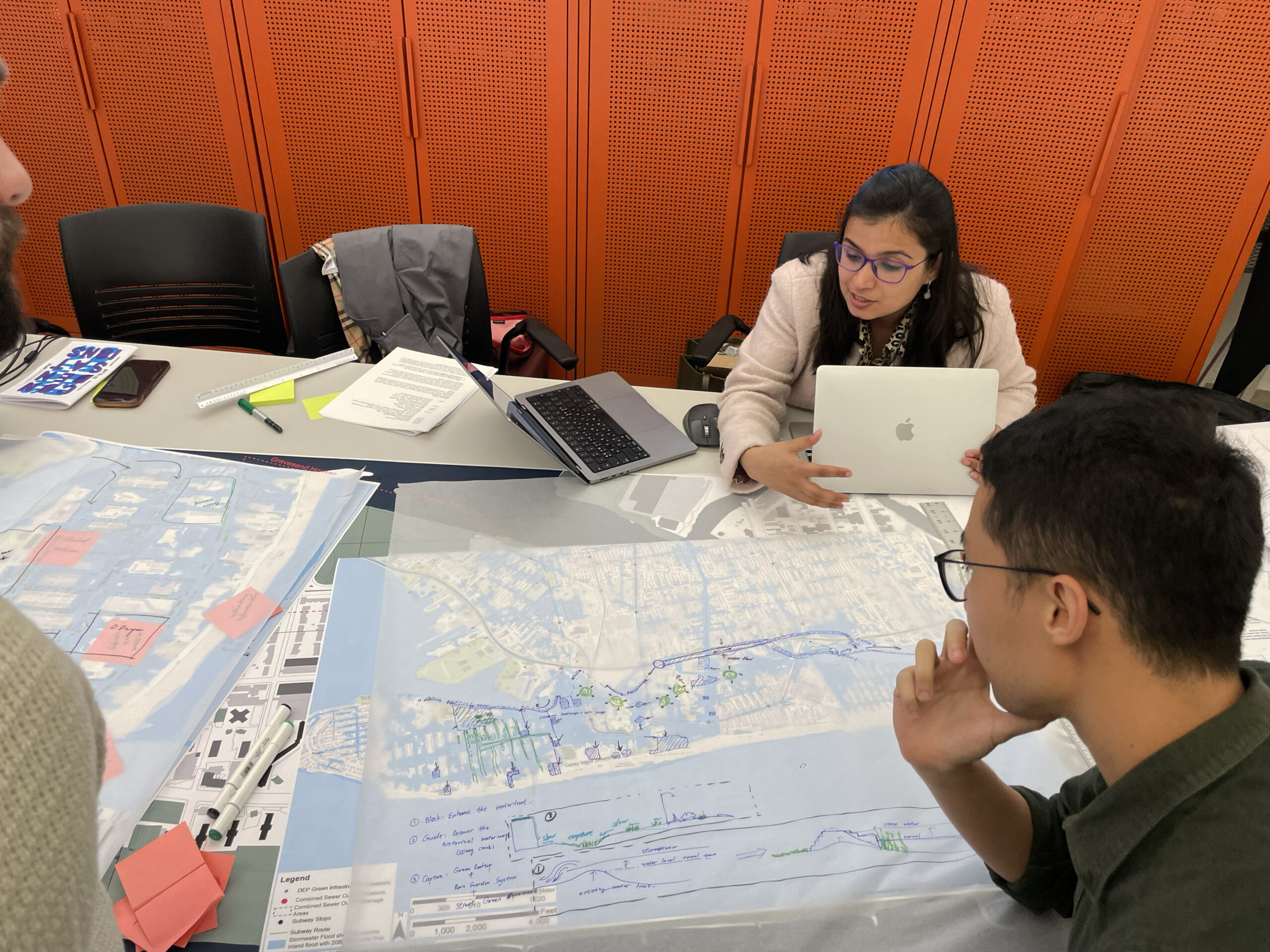 students going over city maps and schematics of new york city