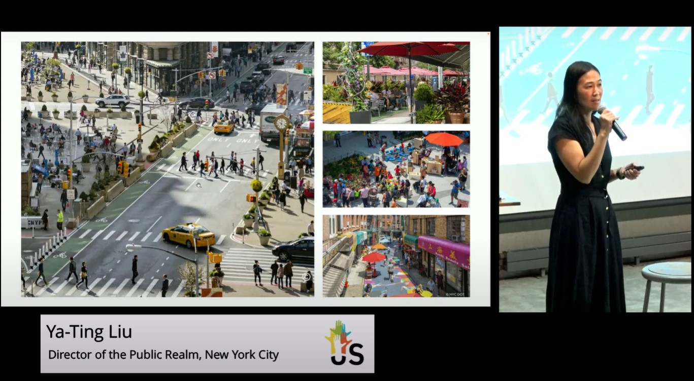 A presentation slide by Ya-Ting Liu, the Director of the Public Realm for New York City, displays several images illustrating urban public spaces. To the left, a large photo shows a busy city street converted into a pedestrian-friendly area with people walking, sitting, and engaging in various activities. There are planters, benches, and a clock, with yellow taxis and other vehicles navigating designated lanes. Smaller images to the right highlight vibrant urban scenes: a patio with tables and umbrellas, a bustling street market with colorful stalls, and a sidewalk cafe with people enjoying outdoor dining. Ya-Ting Liu is pictured on the right side of the slide, holding a microphone and presenting to an audience. The background behind her features a light blue screen with indistinct details.