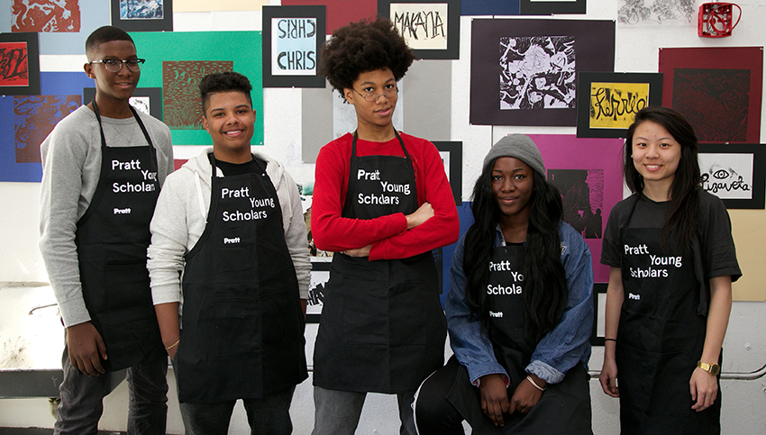 Five Young Scholars Program students stand in front of the art they have created.